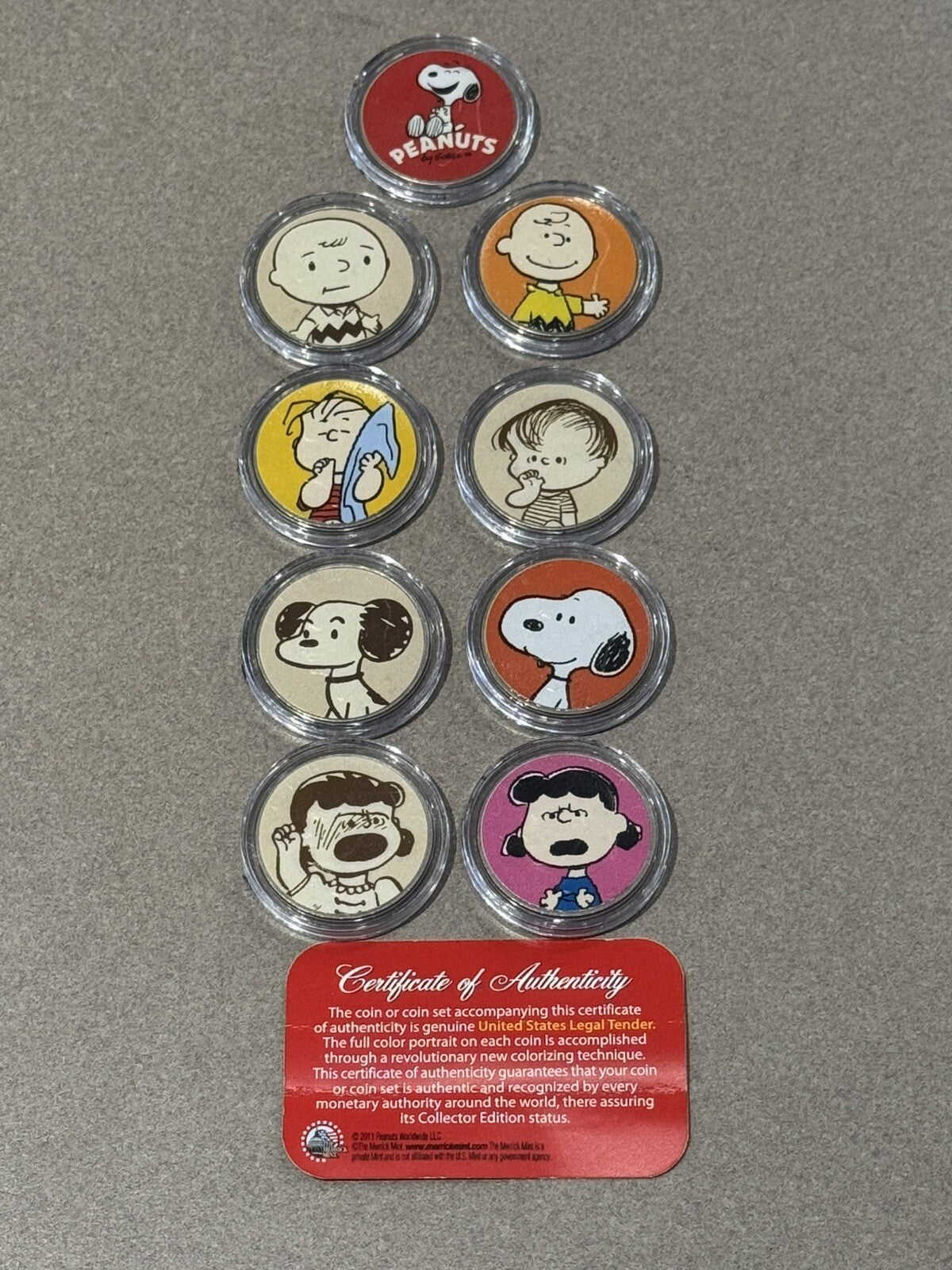 2011 NINE COIN PEANUTS MERRIK COLORIZED COIN COLLECTION WITH COA