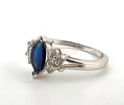 Ladies sterling silver ring with blue stone and CZs