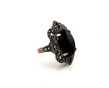 Sterling silver ring with black main stone