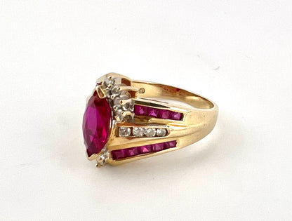 14K yellow gold ladies, Marquis shaped ruby and diamond ring