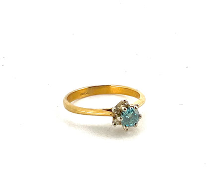 18K yellow gold ring with blue diamond main stone