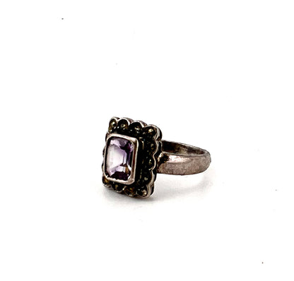 Ladies silver rang with purple main Stone