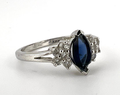 Ladies sterling silver ring with blue stone and CZs