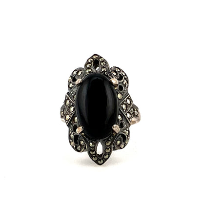 Sterling silver ring with black main stone