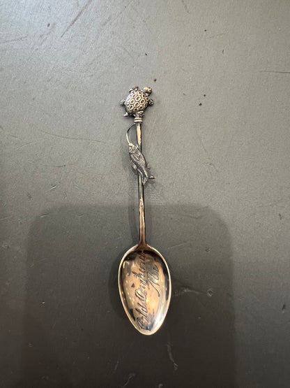 Silver spoon with Old Orchard text and fish design