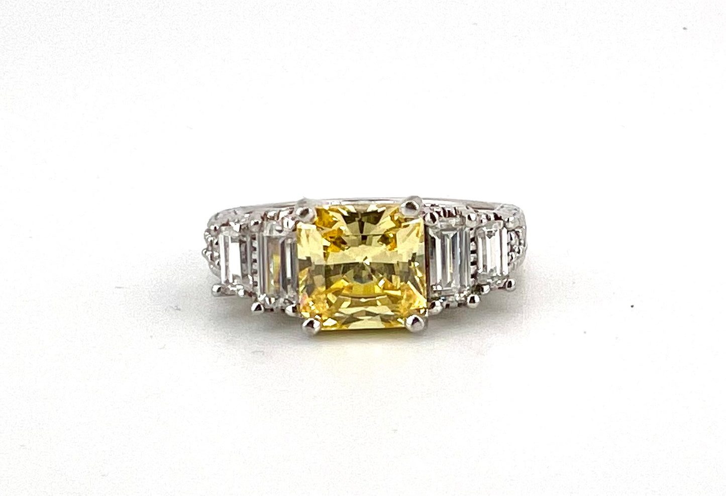 Ladies Sterling silver ring with yellow stone, and CZ baguettes