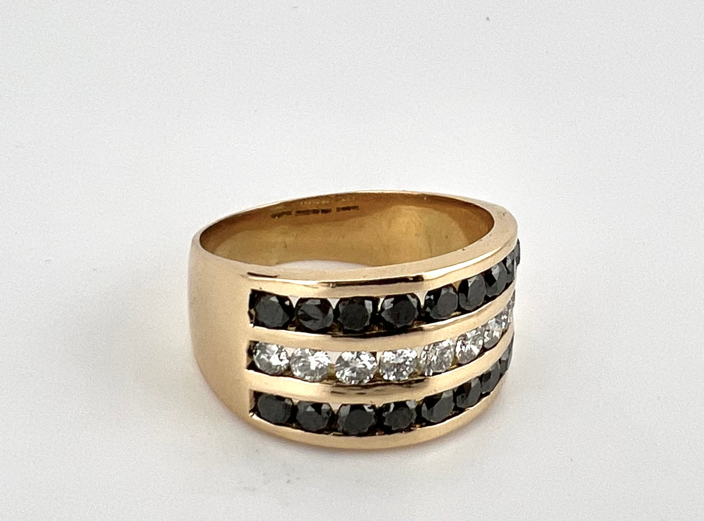 18K yellow gold three row channel set white and black diamond wedding band