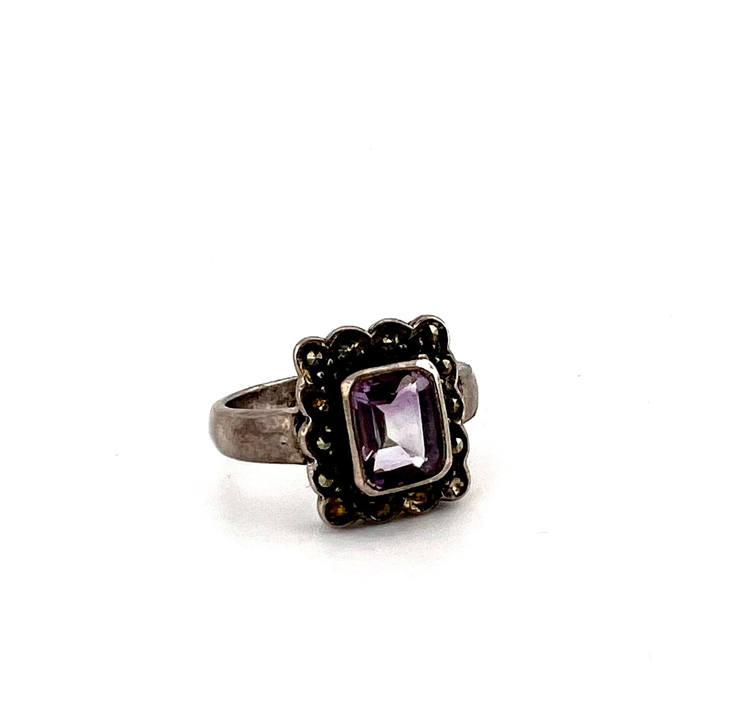 Ladies silver rang with purple main Stone