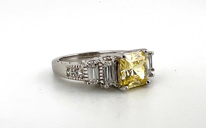 Ladies Sterling silver ring with yellow stone, and CZ baguettes