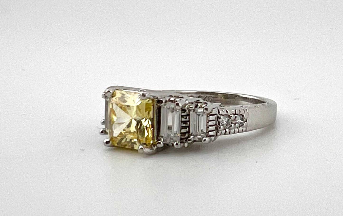 Ladies Sterling silver ring with yellow stone, and CZ baguettes