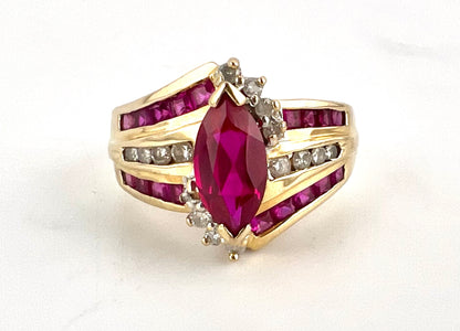 14K yellow gold ladies, Marquis shaped ruby and diamond ring